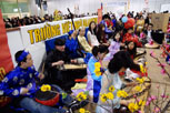 numerous musicians sitting down with their traditional vietnamese instrument - the zither (also known as Dan Tranh)