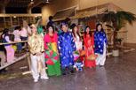 6 young people wearing traditional vietnamese costumes standing in a row
